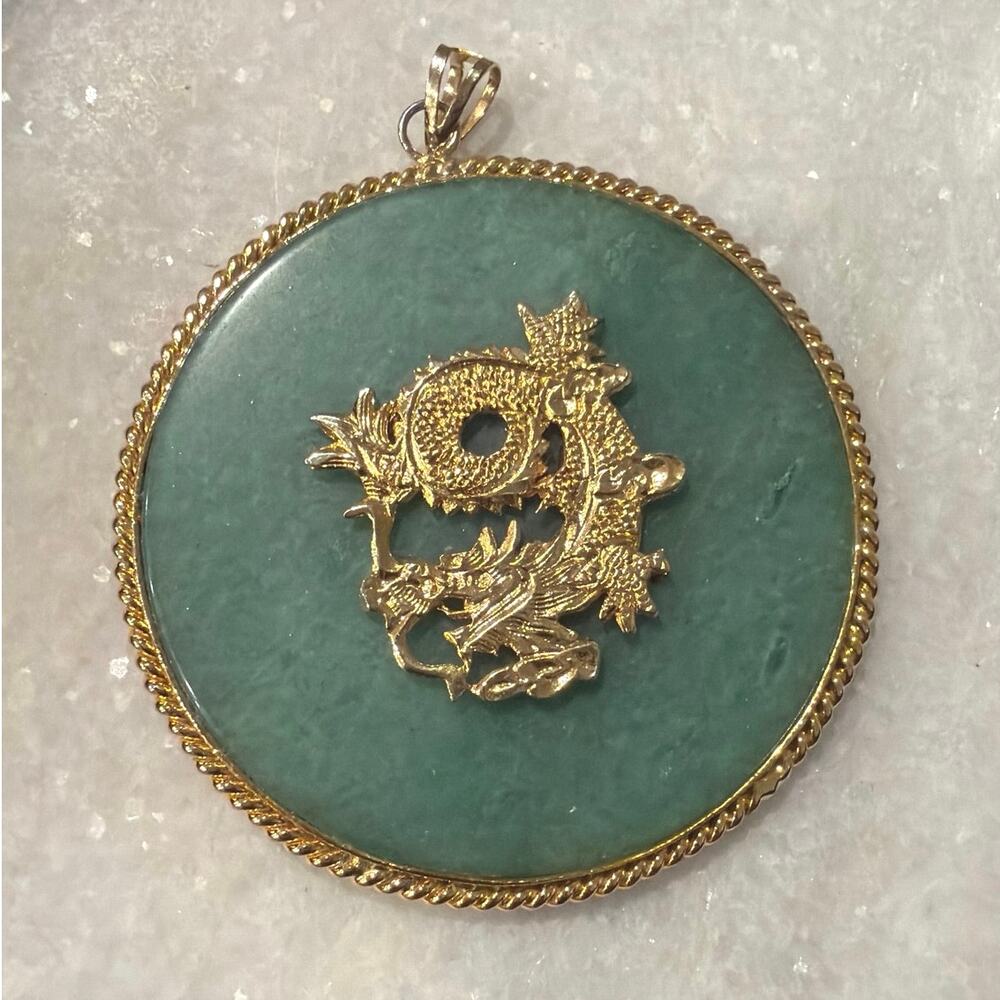 Vintage Chinese pendant gold tone dragon centered on a circular green jade disc